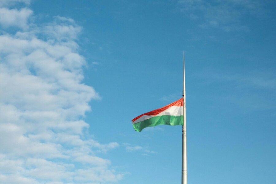 a flag is flying high in the sky