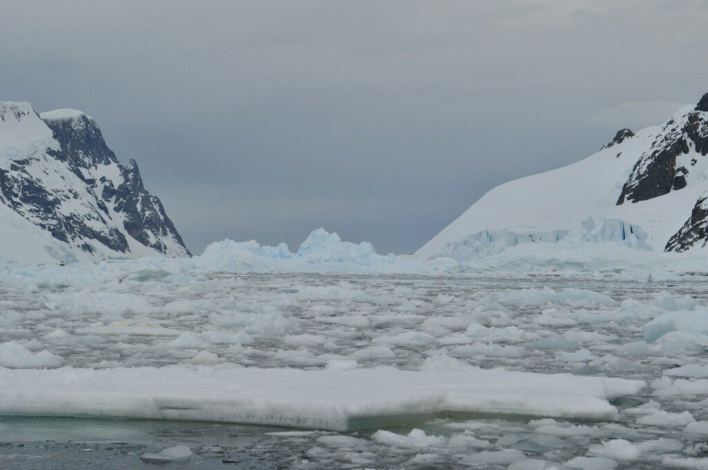 a snowy landscape with mountains