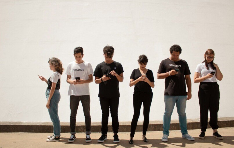 group of people standing on brown floor