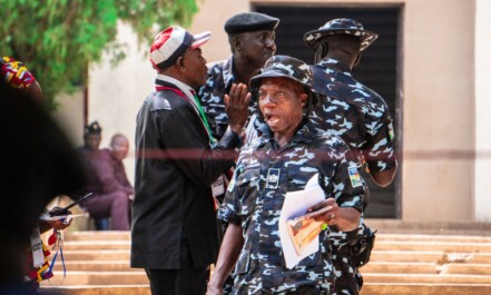 A group of people standing around each other