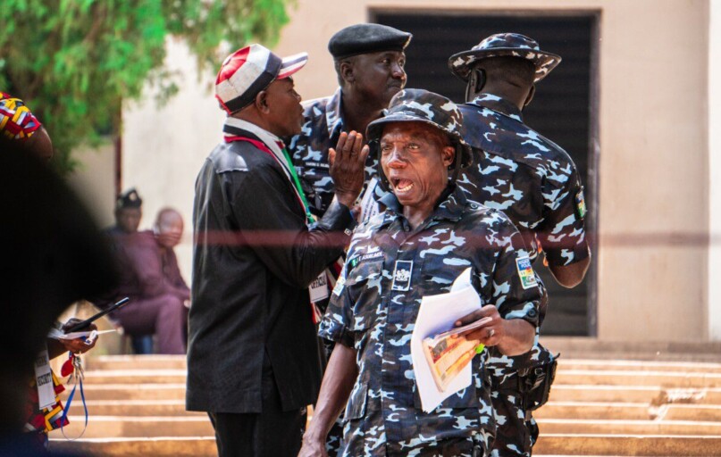 A group of people standing around each other
