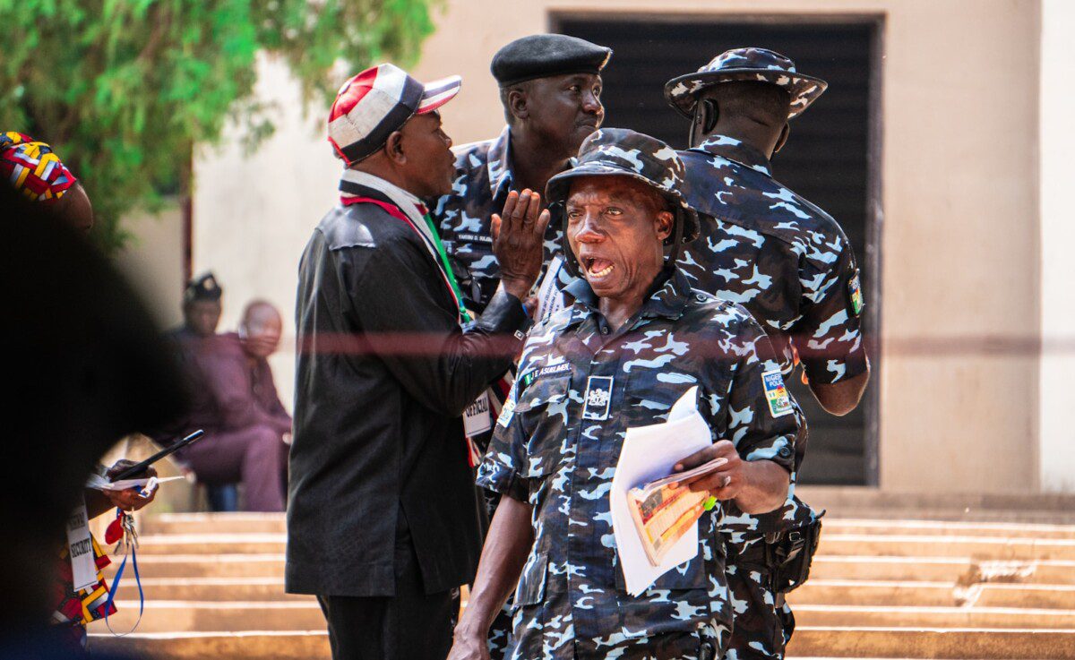 A group of people standing around each other