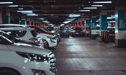 different vehicles parking on garage area of the building