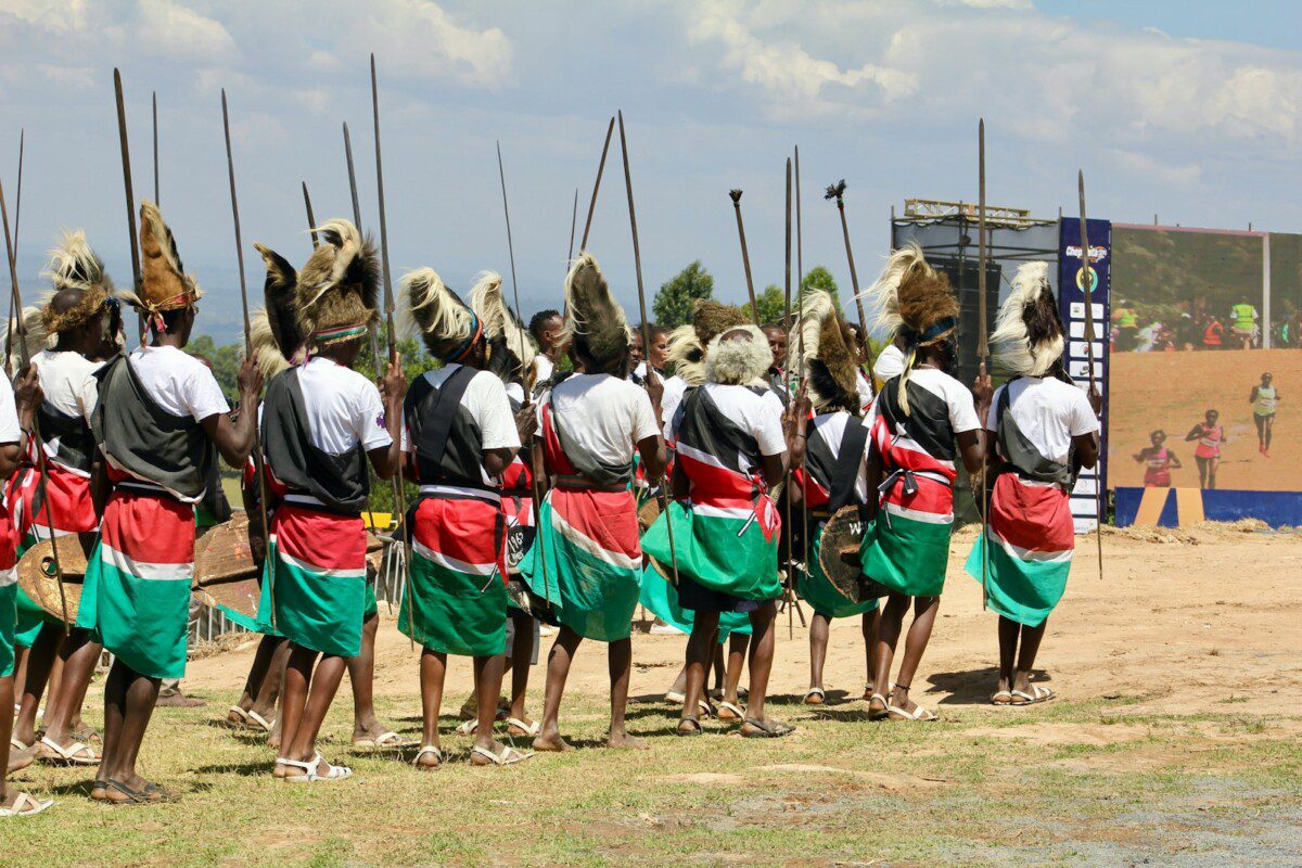 Warriors in traditional attire with spears