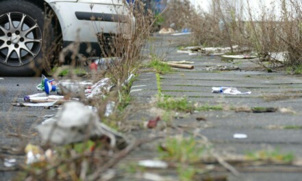 a white car parked on the side of a road