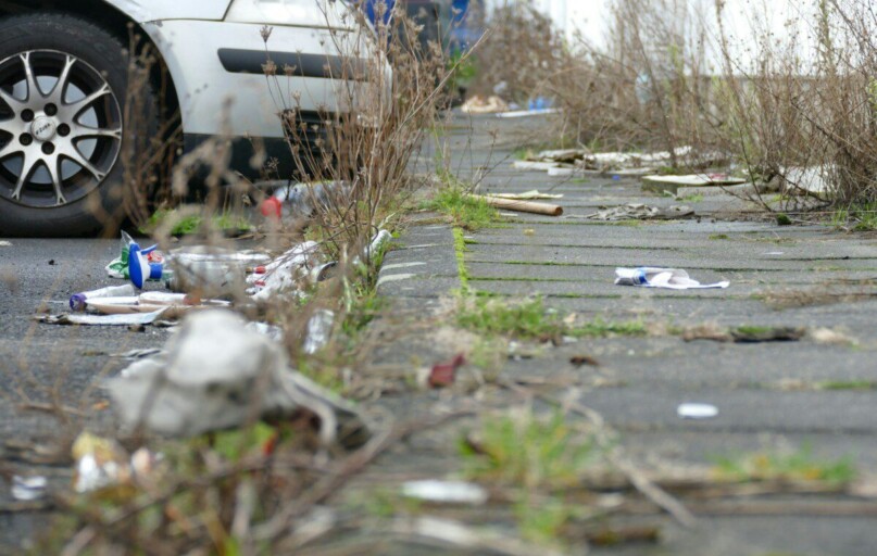 a white car parked on the side of a road