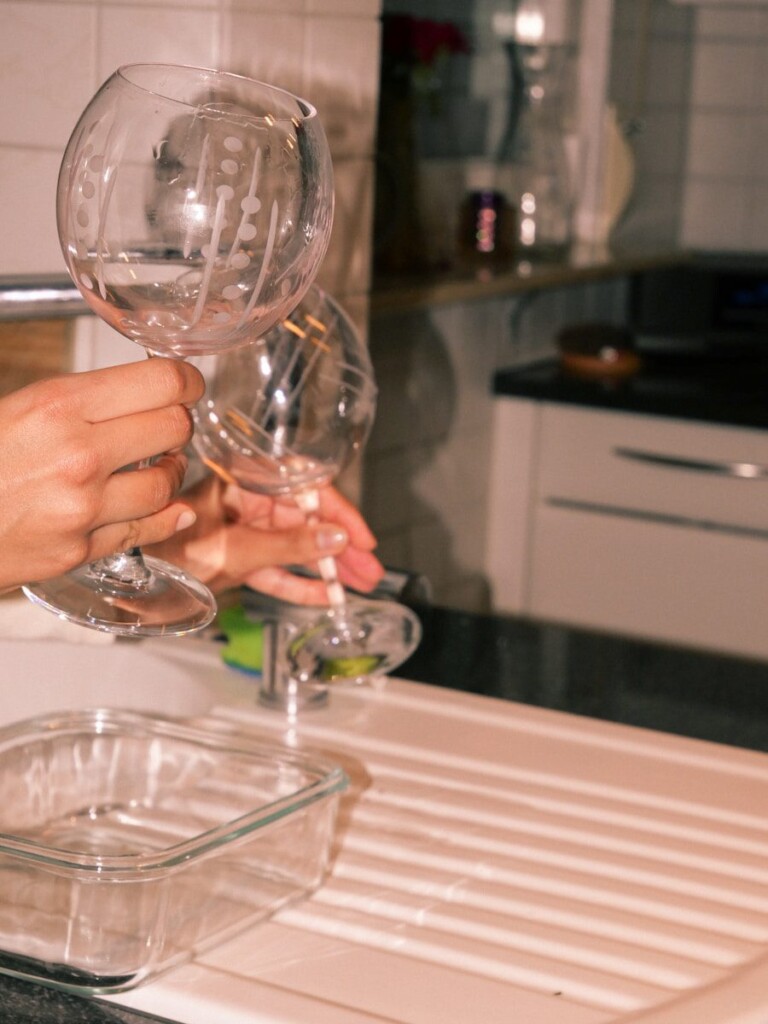 A couple of people that are holding wine glasses