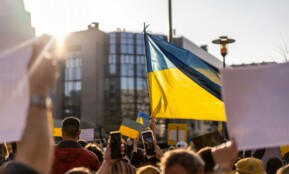 a group of people holding flags