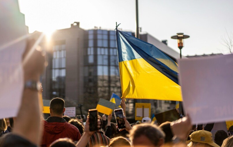 a group of people holding flags