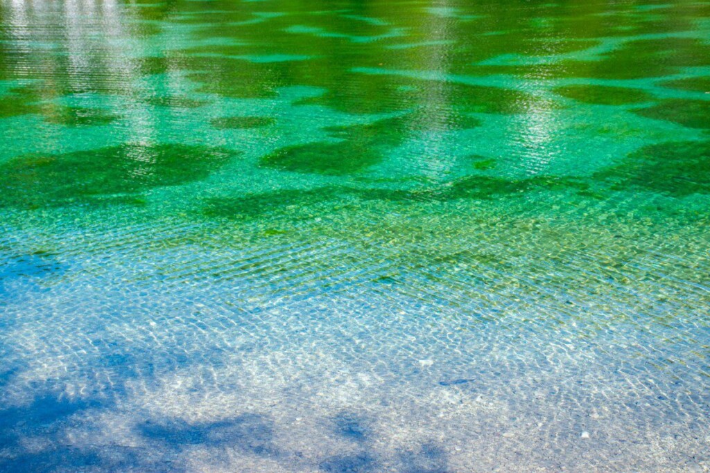 green water with white sand