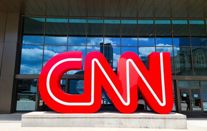 the cnn logo is displayed in front of a building