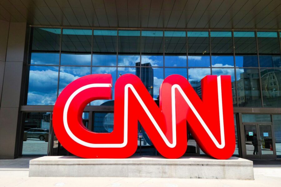 the cnn logo is displayed in front of a building