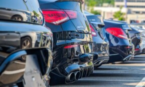 a row of parked cars in a parking lot