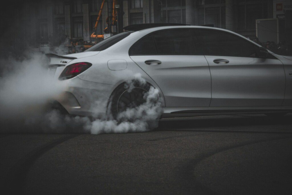 silver sedan on road during night time