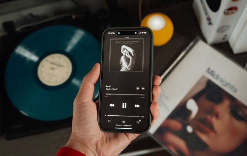 a person holding a cell phone in their hand