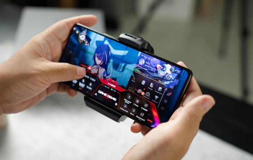 A person holding a cell phone in their hand