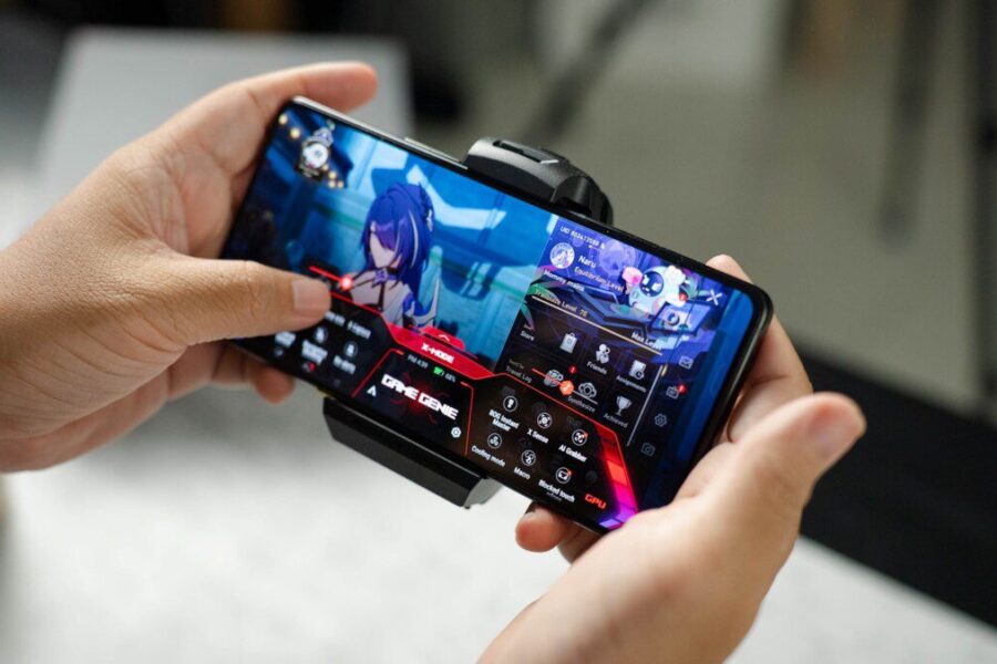 A person holding a cell phone in their hand
