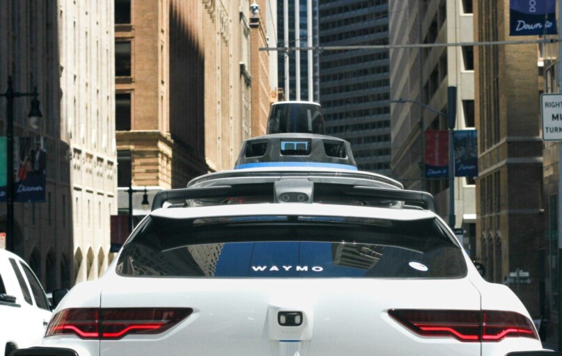 a car that is driving down the street