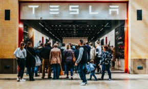 a group of people standing outside of a building