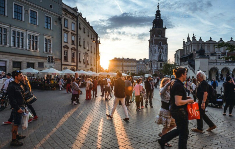 people walking on street near concrete buildings