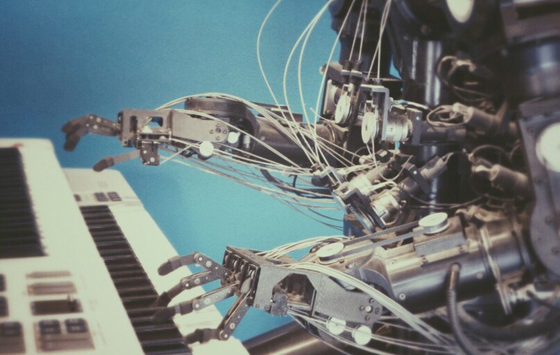 robot playing piano