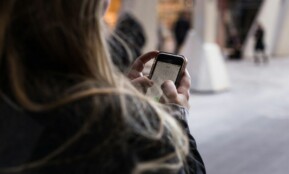 person unlocking smartphone