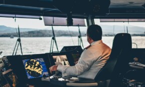 man in white dress shirt sitting on black chair