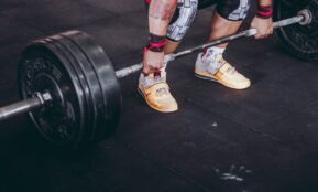 person holding the barbell