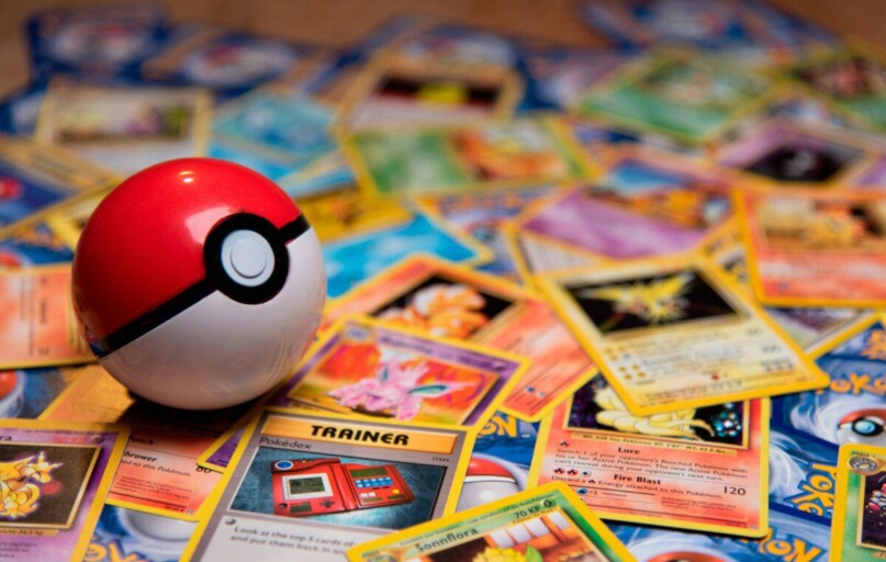 red and white ladybug toy on white and yellow book