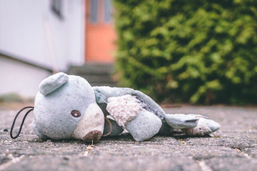 photo of bear plush toy on pavement
