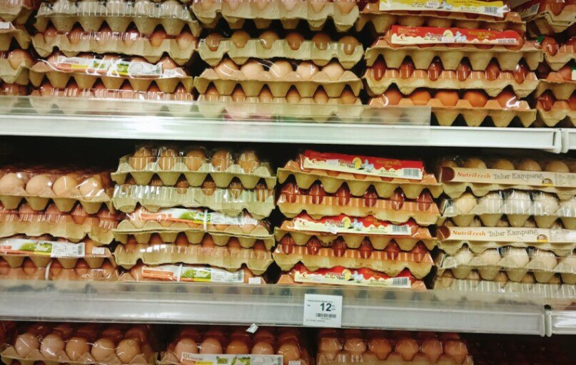 a display in a grocery store filled with lots of eggs