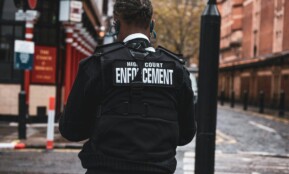 man in black and white adidas jacket wearing black and white headphones