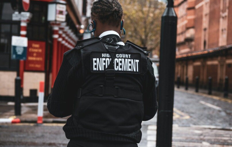 man in black and white adidas jacket wearing black and white headphones