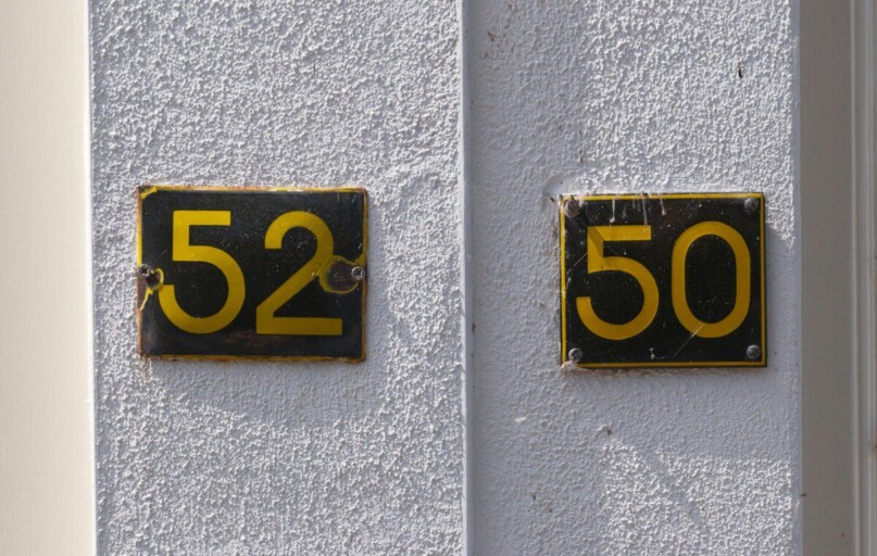 House numbers 52 and 50 are shown.