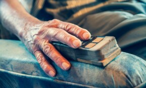 person sitting on sofa chair