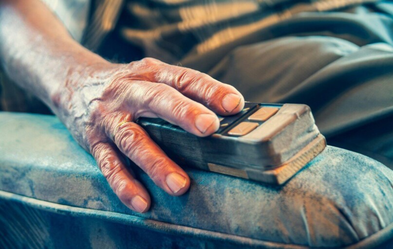 person sitting on sofa chair