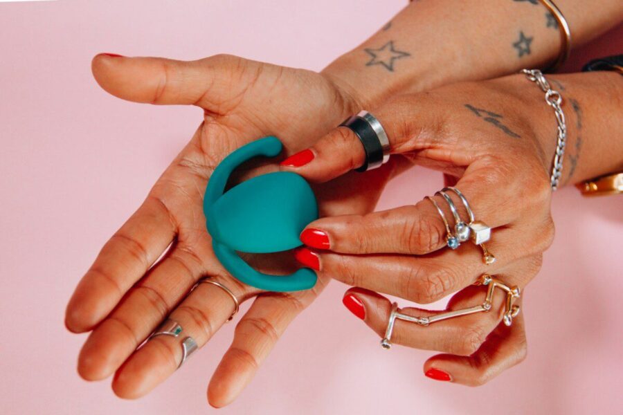 person holding blue toy