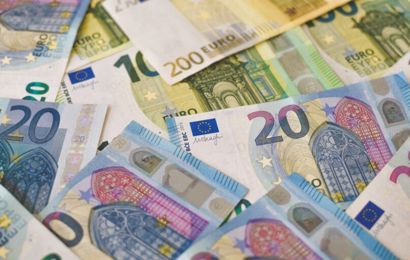 20 euro bill on white and blue textile