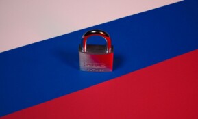a padlock on a red, blue, and pink background