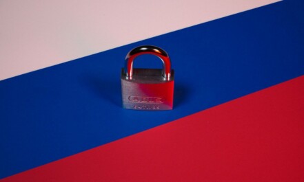 a padlock on a red, blue, and pink background