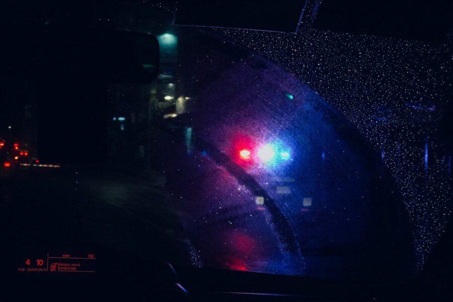 a close up of a car's rear view mirror at night