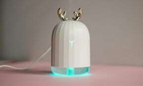 an electronic device with two birds on top of it