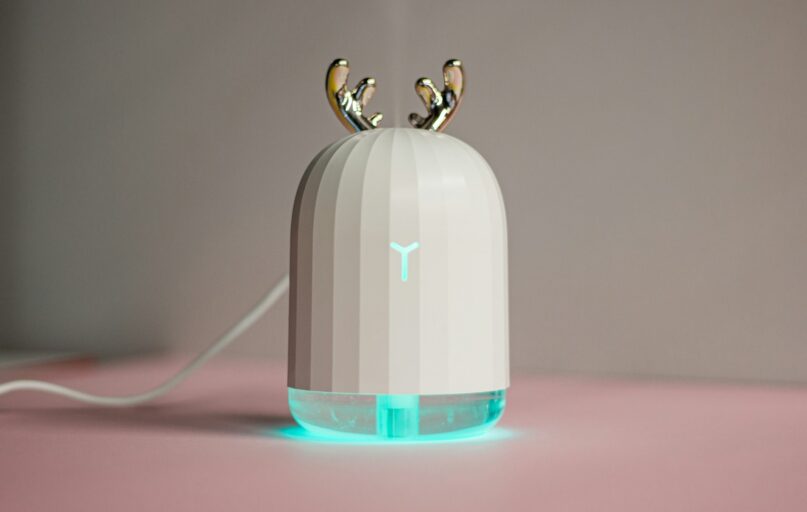 an electronic device with two birds on top of it