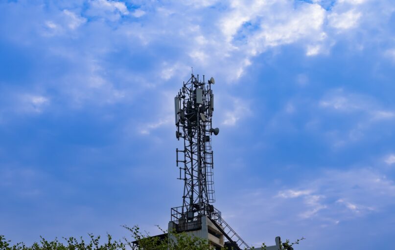 a tower with a cell phone on top of it