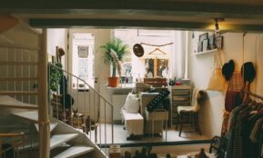 empty spiral staircase near white wooden door