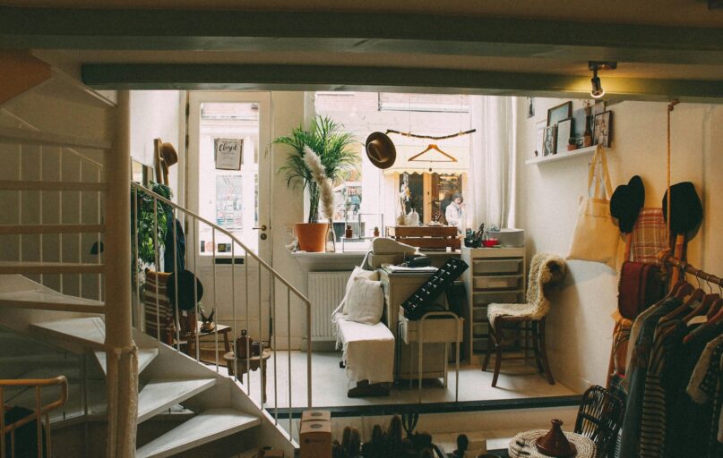 empty spiral staircase near white wooden door