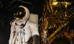 man in white suit wearing white helmet