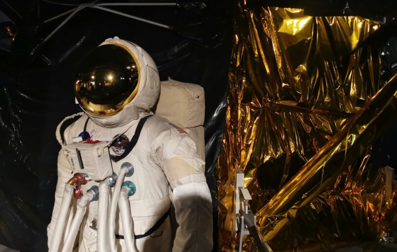 man in white suit wearing white helmet