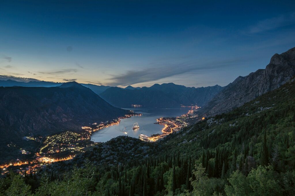 green trees and mountains during daytime