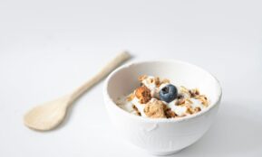 a bowl of cereal with a spoon on the side